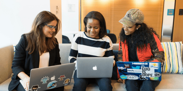 Three young women on laptops