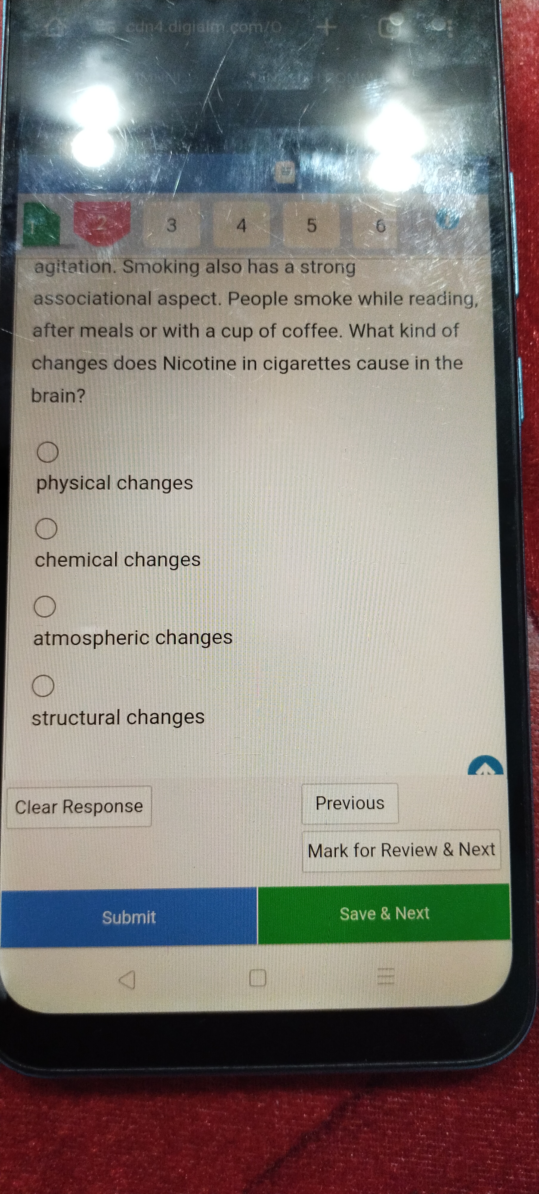 What kind of changes does Nicotine in cigarettes cause in the brain?